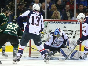 Mitchell Stephens of the Knights scores the winning goal, lifting the puck over Mike DiPietro of the Windsor Spitfires for a 3-2 lead in the third period of their playoff game on March 26, 2017 at Budweiser Gardens. London's Max Jones added two empty-netters for a 5-2 final.