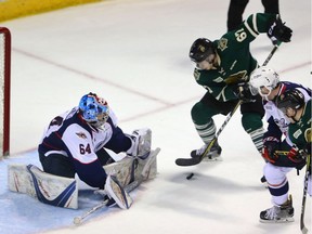 Mitchell Stephens scores a goal against Spitfires goalie Michael DiPietro to make it 2-1 during Game 5 of their OHL Western Conference quarter-final playoff game on Friday March 31, 2017 at Budweiser Gardens.