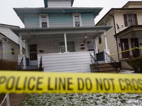 Police tape is used at 924 Elsmere Ave., after a man died of gunshot wounds on March 18, 2017.