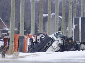 EMS paramedics and Lakeshore fire work at the scene of a head-on collision between a tractor trailer and a snowplow on County Road 42, east of County Road 22 in Lakeshore on March 14, 2017. Both drivers were taken to hospital with non-life-threatening injuries.