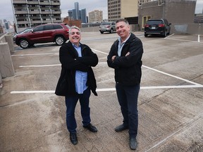 Mark Boscariol, left, and Mark Schincariol are shown on the top level of the Pelissier Street parking garage on March 1, 2017. The two businessmen and a third investor want to submit a proposal to buy the structure.