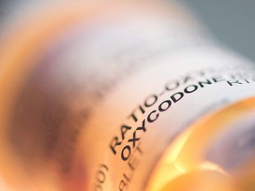 A bottle containing the pain medication oxycodone and acetaminophen is shown in this file photoe.