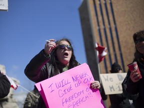 Protesters demonstrating against the anti-Islamophbia Motion-103 were met by counter-demonstrators outside City Hall in downtown Windsor, Saturday, March 4, 2017.