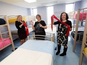 The Downtown Mission unveiled their new dormitory and program for homeless women on Tuesday, March 28, 2017. They also received a $40,000 cheque from Caesars Windsor to support the new initiatives. Fiona Coughlin, left, director of development at the Mission, Linda Fengler, centre, a client and volunteer at the Mission and Susanne Tomkins, public and community relations specialist with Caesars Windsor celebrate the opening of the dormitory.