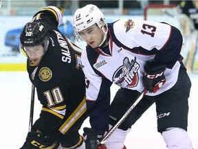 Sarnia Sting's Anthony Salinitri (10) and Windsor Spitfires' Gabriel Vilardi (13) battle for the puck in the first period during an Ontario Hockey League game at Progressive Auto Sales Arena in Sarnia, Ont., on Wednesday, March 15, 2017.