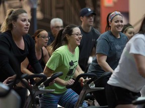 Participants in the Spin4Kids event at the GoodLife gym on Dougall Road in Windsor pedal to raise money for charity on March 4, 2017.