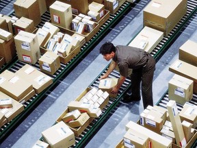 A driver sorts packages in the hub at a United Parcel Service facility in an undated photo.