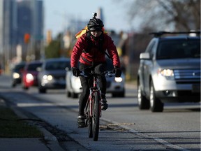 Tony Chau cycles along McDougall Avenue in Windsor on March 8, 2017. Chau has had several close calls with drivers while commuting.