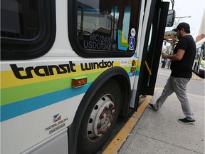 A passenger boards a Transit Windsor Bus at the terminal in Windsor on May 12, 2016.