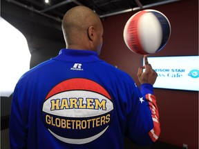 Harlem Globetrotter Dizzy Grant performs at Windsor Star News Cafe on April 15, 2014.