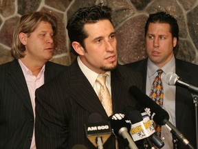 Bob Boughner, centre, along with Peter Dobrich, left, Warren Rychel address the media on Feb. 13, 2006 after becoming the new owners of the Windsor Spitfires hockey team. In 2006, the OHL team had an estimated value of $6 million. According to an analyst, the team is now worth about $13.26 million.