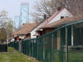 The Ambassador Bridge is seen in west Windsor on April 20, 2016. Abandoned homes remain on Indian Road and several west-end streets near the bridge.