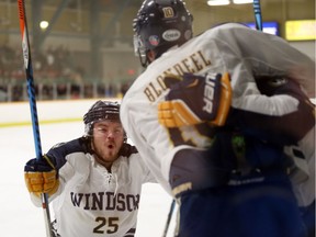 Windsor Lancers Kyle Haas congratulates Blake Blondeel following a second-period goal against York University at the South Windsor Recreation Complex on March 1, 2017.