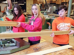 High school students Zara Soulliere, left, Amber Gillis and Erica Chadwick work in the carpentry lab while attending Build-A-Dream March Break camp at St. Clair College on March 17, 2017. Young women, aged 14-17 years, participated in hands-on workshops in carpentry, machining and welding.