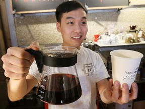 Henry Kim, 24, of Cafe March 21 on Pelissier Street, pours a cup of hand-dripped coffee in his shop on March 22, 2017.