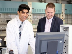High school student Marcus Deans, left, meets with University of Windsor Prof. James Gauld in the chemistry teaching laboratory on March 24, 2017.
