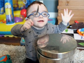 Luke Hornick uses a tablespoon to make some noise Friday March 24, 2017.  Luke was born premature and given little chance to survive. Now almost two years old, Luke is considered a 'miracle baby.'