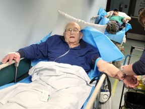 Windsor Regional Hospital patient Donat Fillion, 82, waits in a hallway of Met campus emergency room with several other patients on stretchers March 3, 2017.