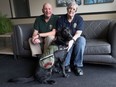 Veterans Richard Hummell and his partner Karen Ann Sutcliffe sit with National Service Dog Bailey (NSD BAILEY) at their Windsor residence on March 9, 2017. Bailey is the service dog for Sutcliffe who is a veteran.