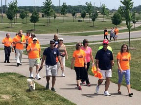 LaSalle Mayor Ken Antaya, second from right, joins a walking group during the County Wide Active Transportation System event near the Vollmer Complex in LaSalle, Ontario on May 31, 2016.