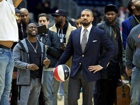 FILE - In this Feb. 12, 2016, file photo, Kevin Hart, left, and Drake coach at the NBA All-Star Celebrity Game at Ricoh Coliseum in Toronto. The league announced on April 25, 2017, that Drake will host its first NBA Awards on June 26. (Photo by Ryan Emberley/Invision/AP, File)