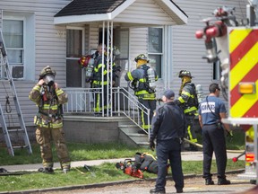 A fire caused $115,000 damage to two buildings Friday and displaced seven people in the 300 block of Chilver Road. (DAX MELMER / The Windsor Star)