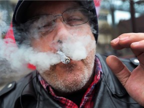 Steve Nael smokes a joint during the 420 celebration at the Charles Clark Square in Windsor on April 20, 2017.