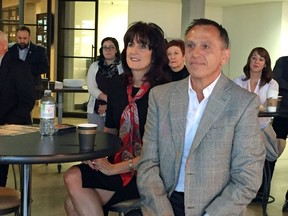 Adrian Vido, 70 Years reUnited co-chairmen, right, and United Way CEO Lorraine Goddard, left, take part in unveiling plans Tuesday morning for United Way Centraide Windsor-Essex County 70th anniversary celebrations, during a reception at the J.P. Wiser's Reception Centre.