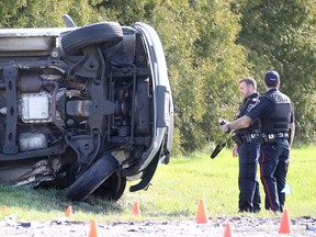 Amherstburg Police Sgt. Matt Capel-Cure and Const. Steve Owen investigate at the scene of a fatal collision on Simcoe Street at Meloche Road Tuesday April 11, 2017.