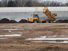 A dump truck unloads dirt near the Aphria company in Leamington on April 21, 2017. The medical cannabis grower is working on a multi-million dollar expansion.