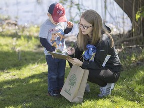 Kathryn Corby and her son, Paul Lefaive, 4, participate in a scavenger hunt at the Earth Day Celebration at Malden Park, Sunday, April 23, 2017.