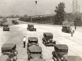 Cars drive off the Ambassador Bridge to the Canadian side in this photo from July 4, 1930.
