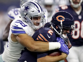 Windsor's Tyrone Crawford, left, of the Dallas Cowboys tackles Brian Hoyer of the Chicago Bears during a game Sep. 25, 2016 in Arlington, Texas.