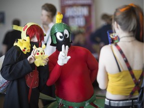 Cody Ippolito, dressed as Pikachu Sasori, left, and George DesRosiers, dressed at Marvin the Martian, pose for a photo at the 3rd annual Comic Book SyndiCon at the St. Clair Centre for the Arts Sunday, April 2, 2017.