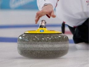 CORTINA D'AMPEZZO APRIL 24, 2009  --  Canada's Allison Nimik (Calgary) delivers a stone against Hungary  during Canada's 7-5 defeat in the semifinals of the 2009 World Mixed  Doubles Curling Championship in Cortina D'Ampezzo, Italy. Canada plays  China in the bronze medal match on Sunday.  CREDIT (preferred): World Curling Federation photo by Urs Raeber