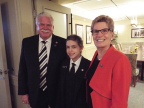 Laura Middleton is seen with MPP Windsor-Tecumseh Percy Hatfield and Premier Kathleen Wynne (right) while working as a page at Queen's Park.