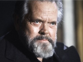 In this Feb. 22, 1982 photo, actor and film director Orson Welles poses for photographers during a news conference in Paris. The University of Michigan in Ann Arbor, Mich., now has the largest comprehensive archive for fans and scholars of renowned filmmaker Orson Welles after the acquisition of never-before-seen work given by his daughter, Beatrice Welles in 2017.