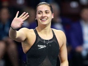 LaSalle's Kylie Masse waves to the crowd after taking silver in the 100M backstroke final during the 2016 FINA World Swimming Championships on Dec. 7, 2016 at the WFCU Centre.