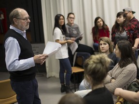 Marty Gervais, left, professional writer-in-residence, is pictured with his publishing and editing practicum class at the University of Windsor, Monday, April 3,  2017.