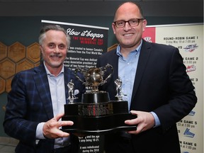 The Memorial Cup trophy will be touring Windsor-Essex when the tournament kicks off next month. The trophy will be displayed during a 10-day tour of Windsor's 10 wards, visiting libraries, community centres, parks and legions. John Savage, part owner of the Windsor Spitfires, left, and Windsor Mayor Drew Dilkens pose with the team's 2009 Memorial Cup trophy during a news conference at City Hall on April 27, 2017.