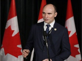 Minister of Families, Children and Social Development Jean-Yves Duclos speaks to reporters at a Liberal cabinet retreat in Calgary, Alta., on Jan. 24, 2017.