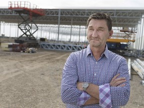 NatureFresh Farms president Peter Quiring stands next to the construction of a new $4-million distribution centre on April 10, 2017.