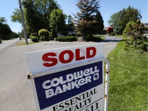 A residential sold sign is shown along Riverside Drive East on Aug. 6, 2015.