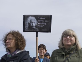 Leo Bacon, 11, holds up a sign with an Einstein quote as he takes part in the March for Science Saturday, April 22, 2017.