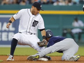 Seattle Mariners' Jarrod Dyson steals second base as Detroit Tigers second baseman Ian Kinsler (3) applies a late tag in the fourth inning of a baseball game in Detroit on April 26, 2017.