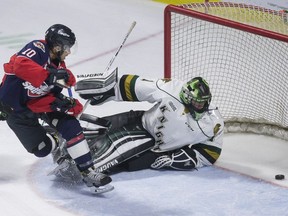 Windsor's Jeremiah Addison scores against London's Tyler Parsons in the third period of Game 6 between the Windsor Spitfires and the London Knights at the WFCU Centre, Sunday, April 2, 2017.