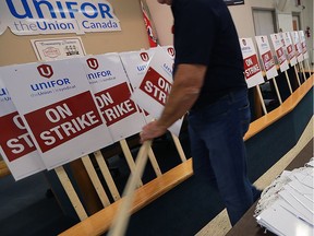 Unifor Local 444 members prepare strike signs for potential work action on Nov. 2, 2016, at the Turner Road union hall in Windsor.