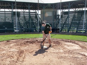 Sports field landscaper Trevor Warner works on renovations at Lacasse Park on April 17, 2017.  The city is asking people to stay off any sports fields or baseball diamonds ahead of the May opening.