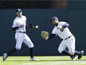 Detroit Tigers right fielder Tyler Collins bobbles and drops the ball hit by Boston Red Sox's Pablo Sandoval during the seventh inning Friday, April 7, 2017, in Detroit.