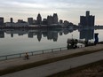 The Detroit city skyline is seen reflected on the Detroit River from Windsor on March 21, 2017.